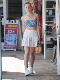 Elle Fanning shows off sweet summer style in a pleated tennis skirt in LA