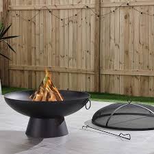 Designed with a fire pit in the centre, surrounded by a table around the periphery of the pit where you can place drinks and food, these are great for people that like to keep warm while socialising. Brooks 31 1 2 W Black Round Wood Burning Outdoor Fire Pit 86w91 Lamps Plus