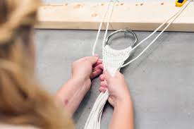 Thread the braids in and out of the loops along the long outside edges of the hammock and through the endmost holes in the spreader bars. How To Make A Hammock