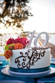 I am looking for an idea for a anniversary design cake. 10th Anniversary Cake With Scroll Design Teal Ribbon And Flowers Jacksonville Fl Weddings First Coast Weddings And Eve Anniversary Cake Cake Cupcake Cakes