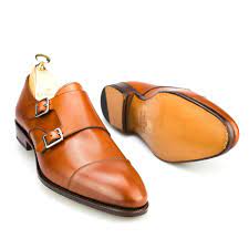 Navy calfskin leather monk straps shoes. Double Monk Strap In Tanned Vegano Carmina