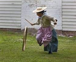 A Girl Plays With A Hoop And Stick In The Yard Of The Benjamin Powell House Colonial Williamsburg Colonial Williamsburg Colonial Williamsburg Va Williamsburg