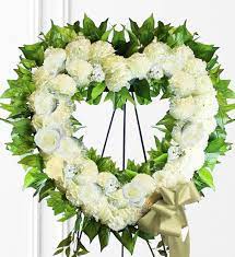 Share condolences with a beautiful funeral vase arrangement today. White Sympathy Heart Wreath Avas Flowers