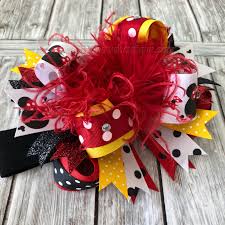 From formal attire to casual apparel, a bright and cheery bow will add a new level of fun and creativity. Buy Black Red And Yellow Minnie Mouse Over The Top Hair Bow Headband Online At Beautiful Bows Boutique