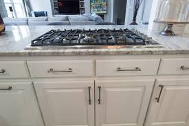 Bright White Raised Panel Cabinets With Atlas Hardware Brush Nickel Cabinet Handle Kitchen Door Handles Kitchen Cabinet Door Handles Beautiful Kitchen Cabinets