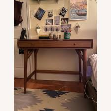 Finished on all four sides and surrounded by a beveled frame, it looks right at home floating in the center of a room. West Elm Mid Century Mini Desk Aptdeco