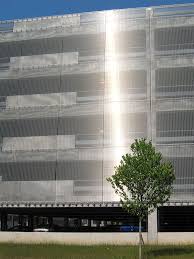 A parking garage is an inherently boring place. Parking Garage Ohio State University The Facade Of The Parking Garage Is Covered With Haver Architectural Mesh Architectural Mesh Architecture Facade