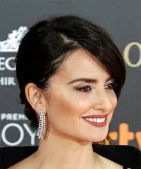 Her nude dress and elegant jewelry do complete justice to her retro look. Penelope Cruz Medium Straight Dark Brunette Hairstyle