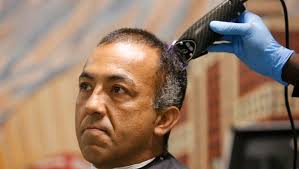 Pima Medical Institute gives homeless haircuts at Opportunity Center