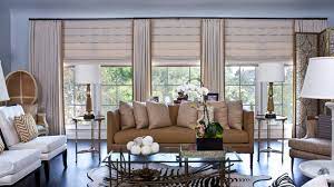 Centre modern furniture around a cubic rug. 20 Living Areas Charmed With Simple Roman Shades Home Design Lover