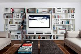 This Modern Apartment Has A Custom Designed Shelving Unit In The Living Room That Shelving Units Living Room Living Room Shelves Built In Shelves Living Room