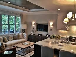 A tray ceiling, which is an inverted or recessed ceiling, creates the illusion of height. Contemporary Tray Ceiling In Living Room