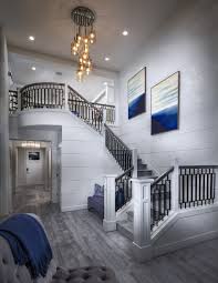 Make A Grand Entrance Down This Beautiful Staircase Featuring The Saheele Home Design At Bayview At Gig Harbor Located Home Home Builders New Home Communities