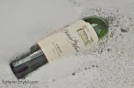 Sand down the edges well before drying off the glass. Wine Bottle Candle Holders Diy Tattered Style