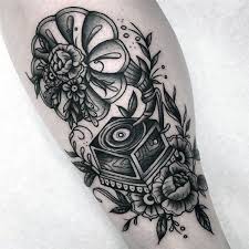 This design has a guitar going through a skull's head. 50 Vinyl Record Tattoo Designs For Men Long Playing Ink Ideas