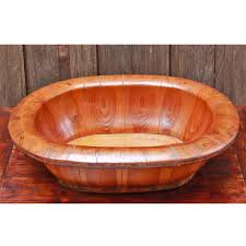 Very cool, antique european enamel baby bathtub sits on a blue wrought iron stand. Chinese Elm Wood Baby Bath Midwives Birthing Basket
