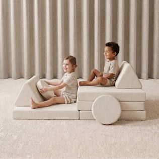 Modular play couch arranged in a creative car shape, AI generated