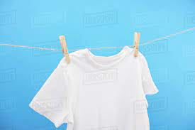 Maybe you would like to learn more about one of these? Close Up View Of Clean White T Shirt Hanging On Clothesline Isolated On Blue Stock Photo Dissolve