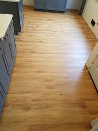 Beautiful Coretec Luxury Vinyl Tile Color Peruvian Walnut This Rockville Maryland Kitchen Looks Worlds Apar Vinyl Flooring Flooring Vinyl Flooring Prices
