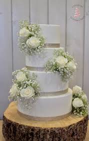More visual appeal can be added to the white cake by including real wedding flowers. Wedding Cakes Las Vegas Custom Cakes