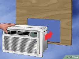 Open the window so that it is slightly wider than the air conditioner, and then lift the air conditioner onto the sill into place. How To Make A Wooden Box For An Ac Unit With Pictures Wikihow