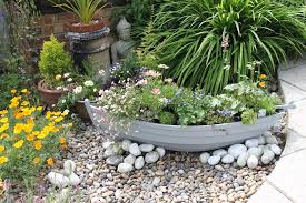 Handmade fiberglass boat planters made in britain by a local fisherman. Seaside Planters Facebook