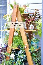Diy ladder plant stand for this guide, you'll need a 1x8x10 foot pine board, polyurethane finish, a belt sander, sandpaper, miter box, framing square, a nail gun, wood glue, table saw, a drill, and a few more supplies. Diy A Frame Folding Plant Stand Created By V