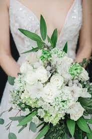 With a variety of flowers and foliage, these for a looser arrangement, try a cascading bouquet in white and purple flowers. Brooklyn Bride With Winter White And Green Wedding Bouquet By Rosewood Productions With Succulen Wedding Bridal Bouquets Wedding Bouquets Green Wedding Bouquet