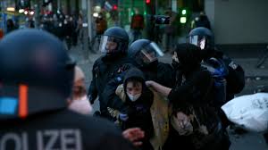A situation in which a large crowd of pe. May 1 Riots Rock Berlin Police Arrest Over 350 People