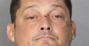 Man arrested at Newark hotel with weapons, drugs