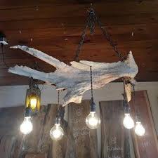 Here is all about beautiful diy lamp / driftwood hanging light. Hanging Driftwood Light Wood Light Fixture Hanging Ceiling Lights Driftwood Chandelier