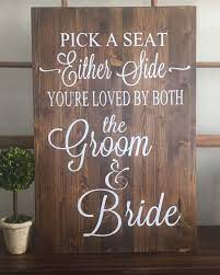This darling decor is made of mdf pieces with a pallet design, a large heart shape, and a decorative white quote that tells the guests to pick a seat, not a side. Rustic Wood Wedding Sign Pick A Seat Not A Side Sign Etsy Wood Wedding Signs Rustic Wood Wedding Signs Wedding Signs Diy