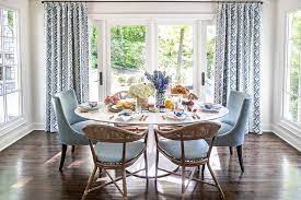 These transitional living room decor ideas can help you find a balance between your current style and your new one. Oval Tulip Dining Table With Blue Dining Chairs Transitional Dining Room