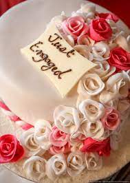 Dessert designs concocted a cake with height for this wedding, but kept the cream cheese frosting beautifully simple. 10 Delicious Engagement Cakes That Will Not Only Take You For A Gastronomical Ride But Will Be A Treat To Your Eyes