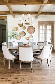 Check out our farmhouse table selection for the very best in unique or custom, handmade pieces from our kitchen & dining tables shops. Farmhouse Dining Room With Rustic Wood Beans And Large Round Wooden Table Farmhousestyle In 2020 Round Dining Room Table Large Dining Room Round Dining Room
