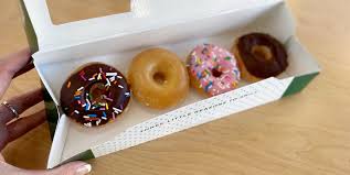 · krispy kreme donuts baked on top of a chocolate brownie batter | foodness gracious. Krispy Kreme Free Mini Doughnut Every Monday From 4 7pm Dealing In Deals