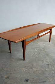 The inventive solution of placing small beans under the countertop brings additional space for storing stuff. Danish Teak Coffee Table By Grete Jalk Osi Modern Teak Coffee Table Square Teak Coffee Table Coffee Table Design Modern