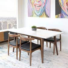 Made from solid rubberwood and mdf with walnut finish, the rectangular table has slightly tapered legs and sleek, minimalist lines. Mid Century Modern Aven Walnut White Top Dining Table Tdad S 275