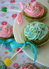 Once the candy had hardened i added a black and white ribbon bow and slid the stick into the side of the cupcakes, creating the baby rattles. 22 Best Baby Rattle Cupcakes Ideas