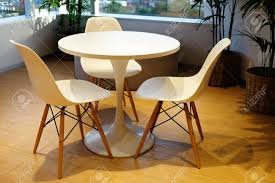 Our dining table and chair sets also give you comfort and durability in a big choice of styles. White Round Table And Three Comfortable Chairs At The Corner Stock Photo Picture And Royalty Free Image Image 101518228