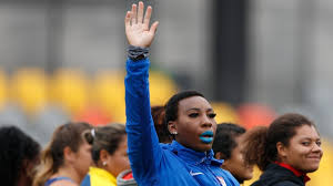 Olympian gwen berry turned away from the us flag as she was p***ed the national anthem played while she stood on the podium during a trial event. Zv3aiztm Vhfqm