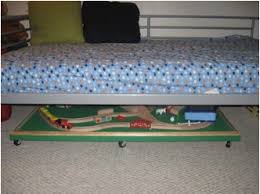 It slides out from underneath the bed and then can be stored again when your child is done playing. Baby Cheapskate Page 248 Saving You Big Bucks On Baby And Kid Stuff