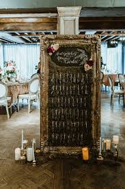 picture of the wedding seating chart was done with moss a