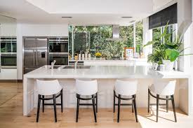 If you prefer a shiny kitchen cabinet, opt for a shellac finish. White Kitchen Celebrity Kitchen Large Kitchen Windows Canopy Rangehood Kitchen Design Centre Kitchen Cabinets And Countertops Kitchen Design
