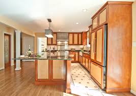 Yellow stone tiles on the wall are suggestive of a rural french country cottage. French Cafe Houzz