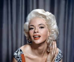 Jayne Mansfield strutting her stuff, barefoot, at the Whiskey A-GoGo in  1964. She loved to take the girls out for an airing! She would be dead 3  years later.