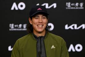 Spain's garbine muguruza smiles as she poses for photographers with her trophy, one day after winning her women's final match against us player. Muguruza Sets Up Azarenka Semi Final Clash At Qatar Open