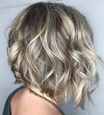 Wavy Angled Bob With Platinum Highlights Medium Bob Hairstyles Short Blonde Hair Wavy Angled Bob