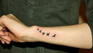 Small Bird Tattoos For Guys Bird Silhouette Tattoos Image By Varsha On Tattoos Small Bird Tattoos Bird Tattoo Wrist