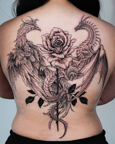 Phoenix and dragon wrapped around a rose. #backpiece #phoenixtattoo #dragontattoo #latattooartist #tattooart